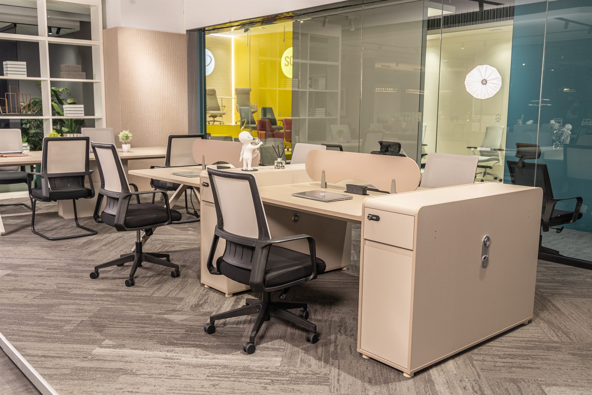 Workstation cluster with pedestals and mesh chairs