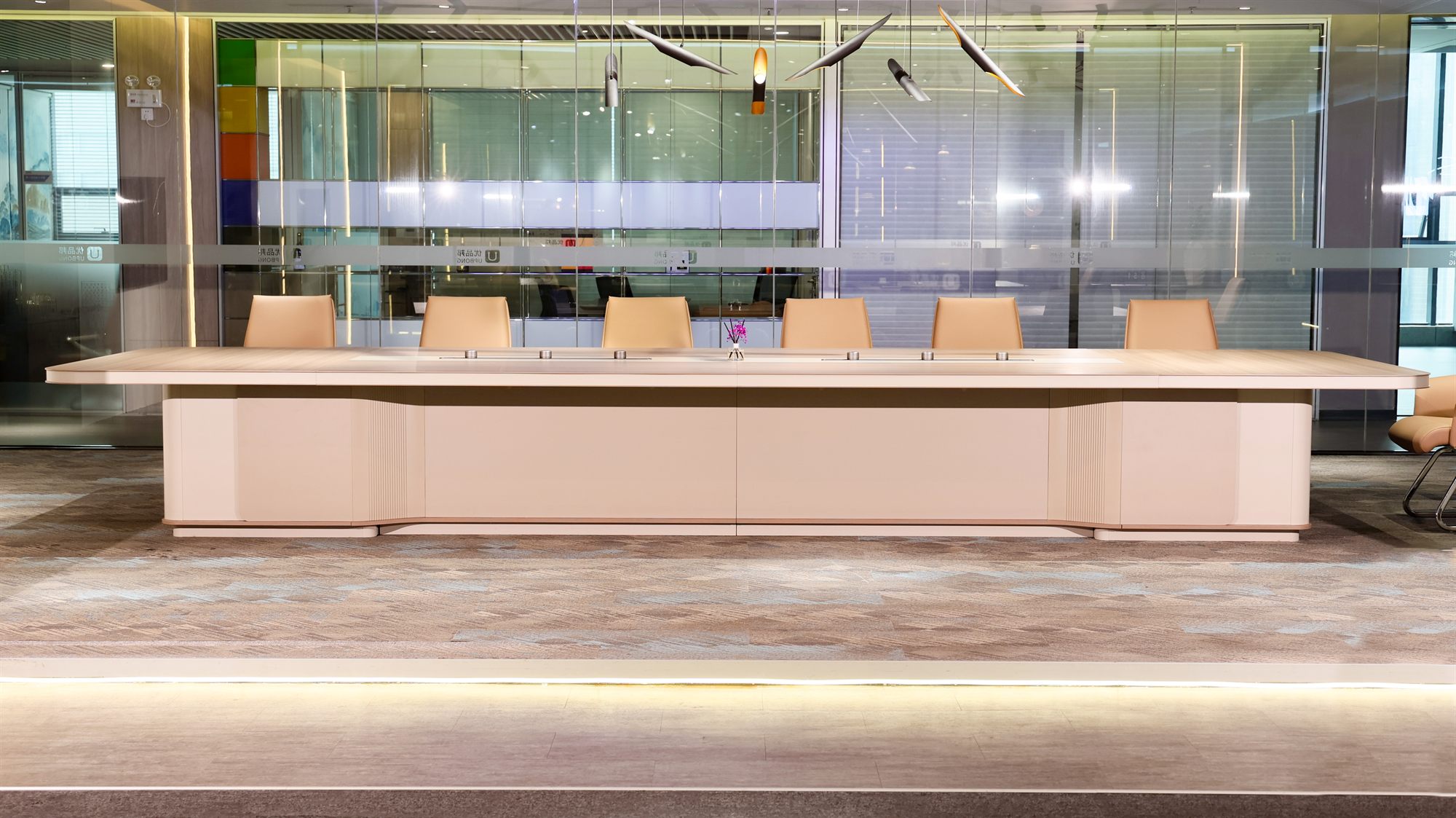 Conference table in a glass-walled meeting room